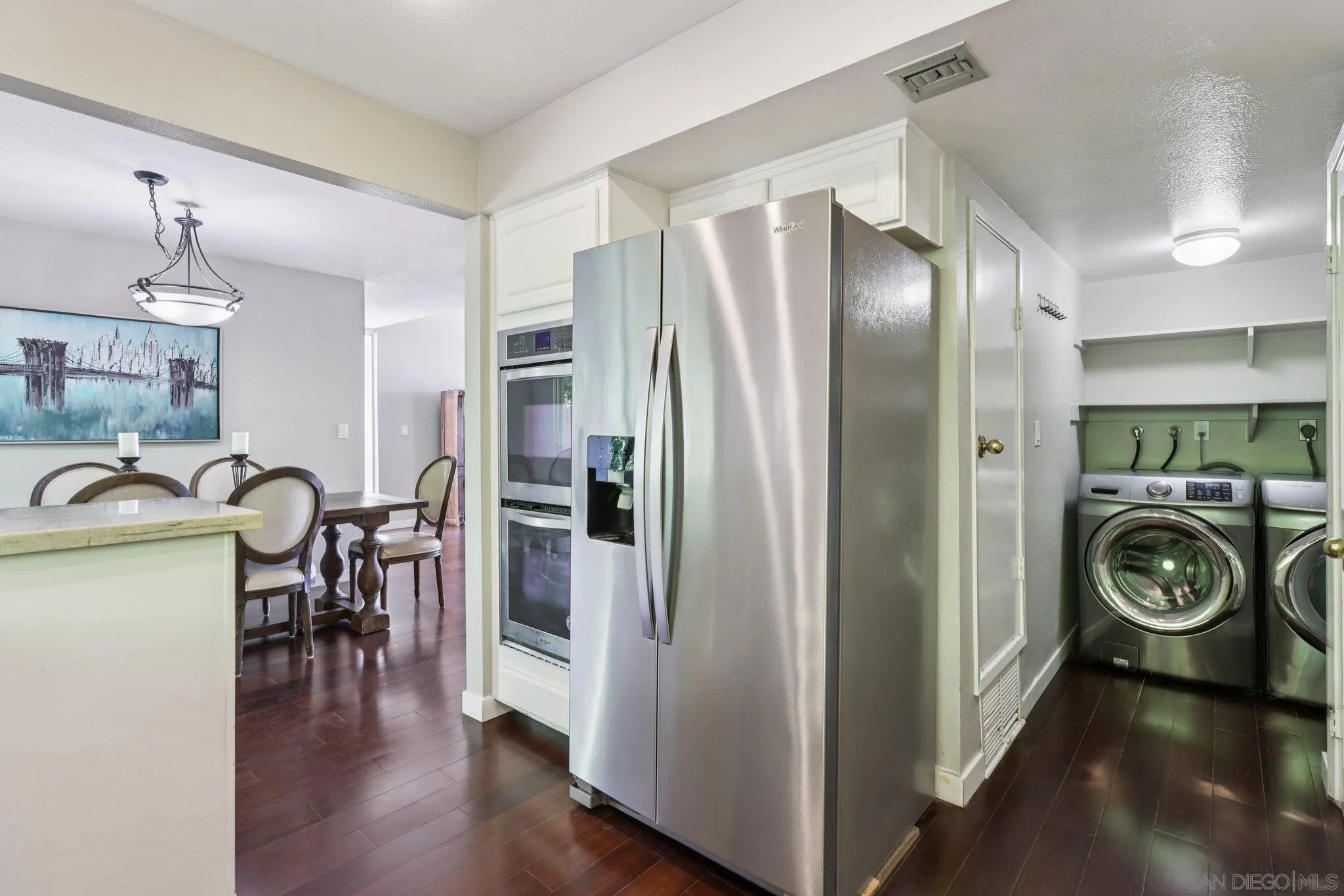 6329 Caminito Estrellado San Diego, CA 92120 - Photo 30 of 61 a view of living room filled with furniture and wooden floor