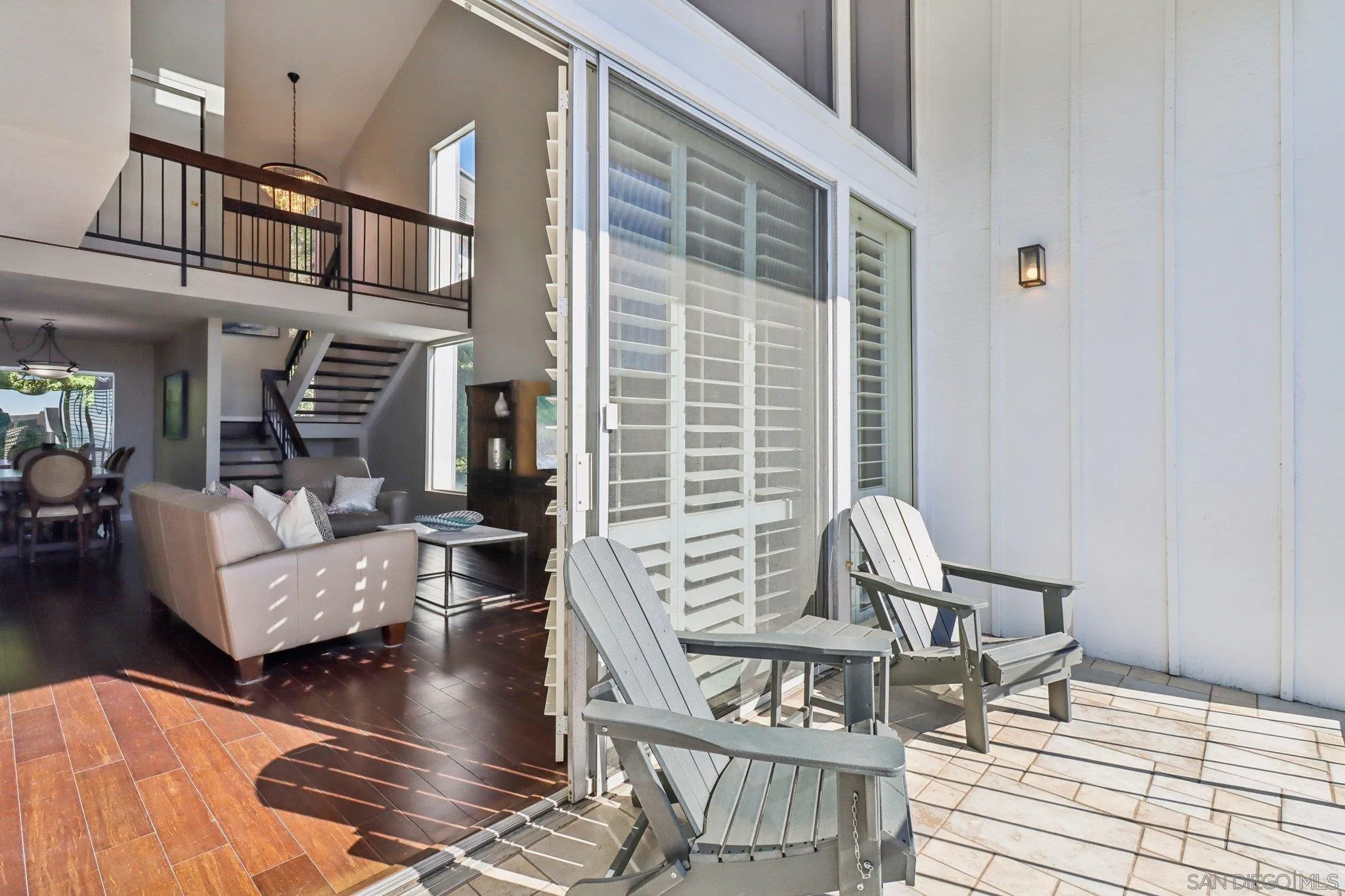 6329 Caminito Estrellado San Diego, CA 92120 - Photo 3 of 61 a view of living room and dining room with furniture wooden floor and a rug
