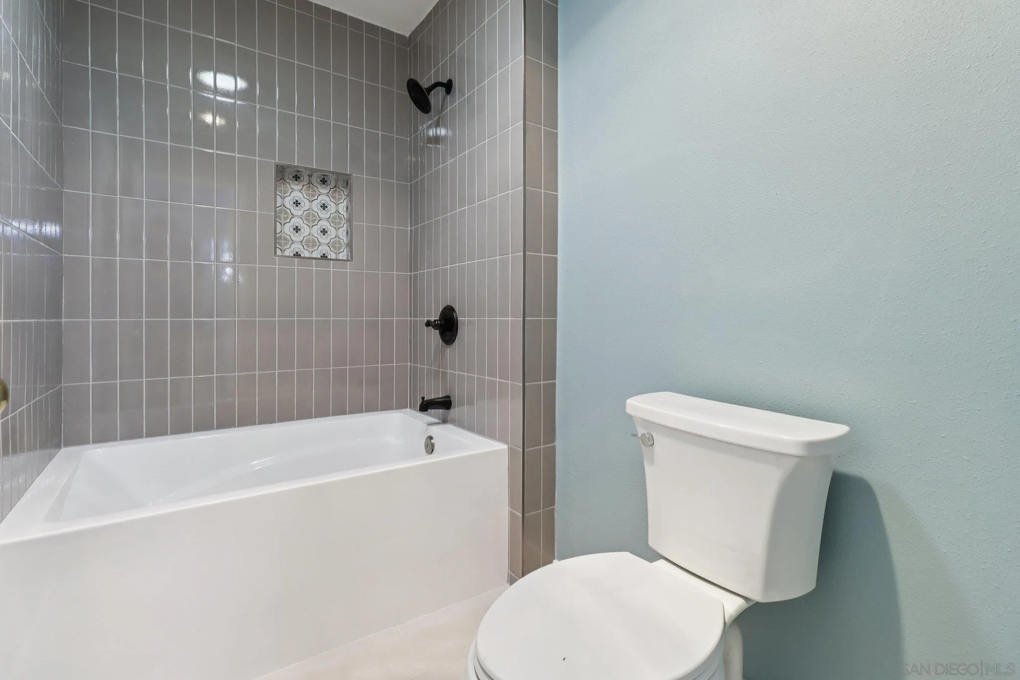 6329 Caminito Estrellado San Diego, CA 92120 - Photo 35 of 61 a white toilet sitting next to a bath tub