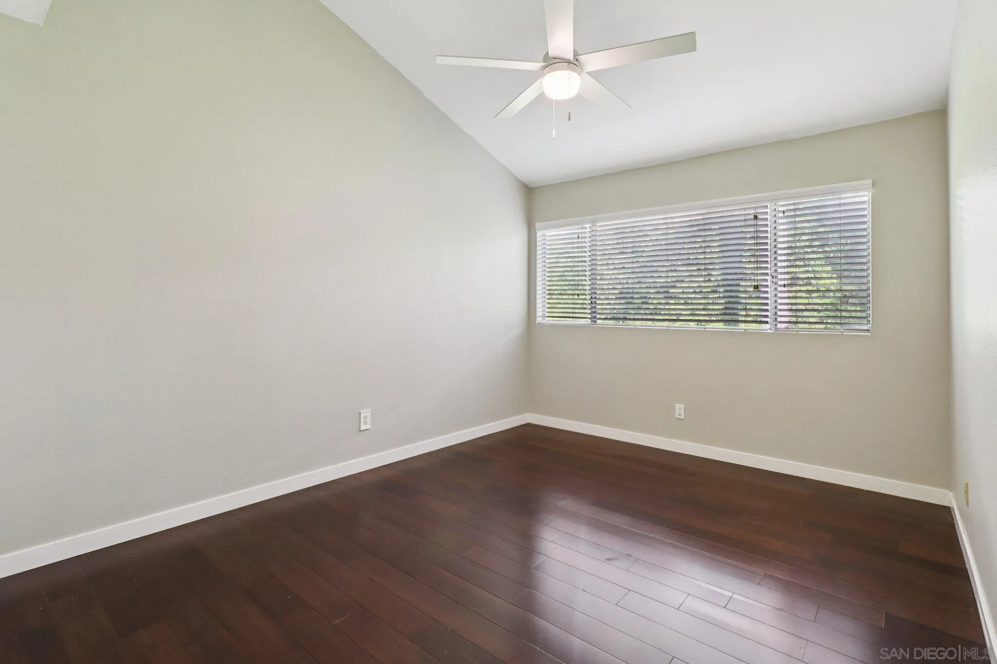6329 Caminito Estrellado San Diego, CA 92120 - Photo 39 of 61 an empty room with wooden floor and windows