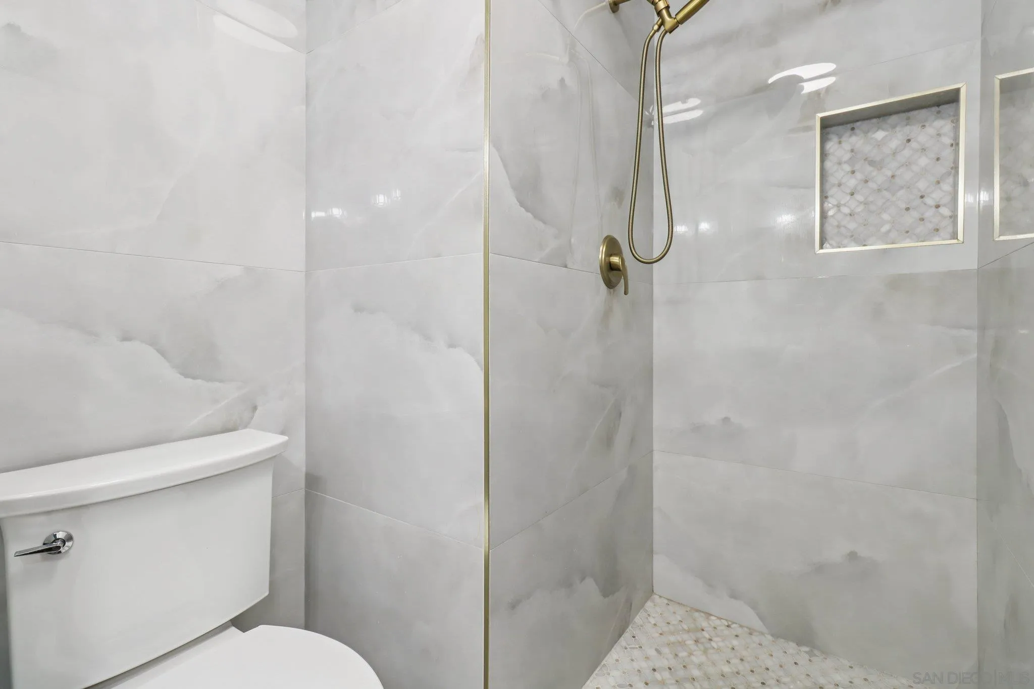 6329 Caminito Estrellado San Diego, CA 92120 - Photo 42 of 61 a bathroom with a shower and toilet