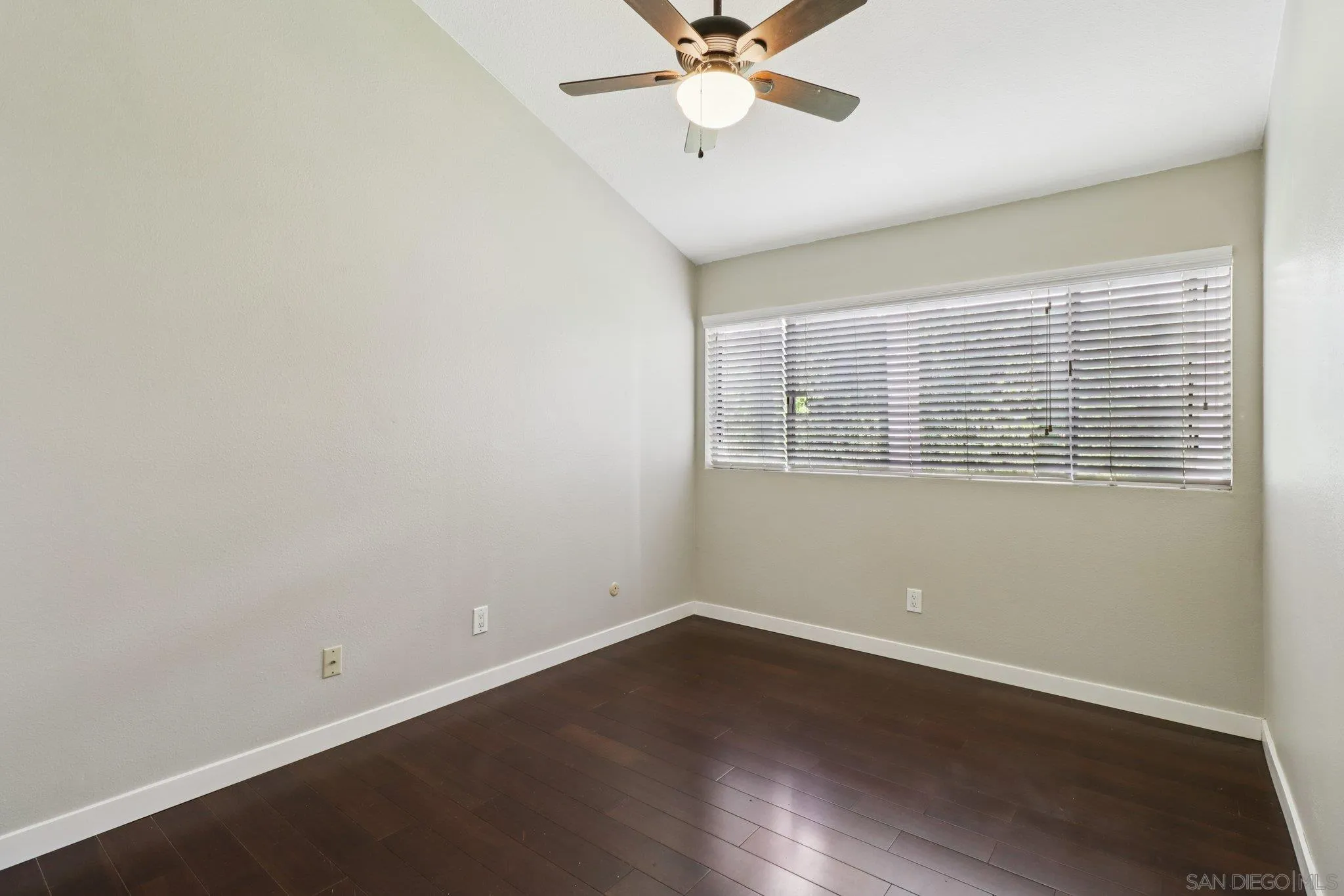 6329 Caminito Estrellado San Diego, CA 92120 - Photo 43 of 61 wooden floor in an empty room with a window