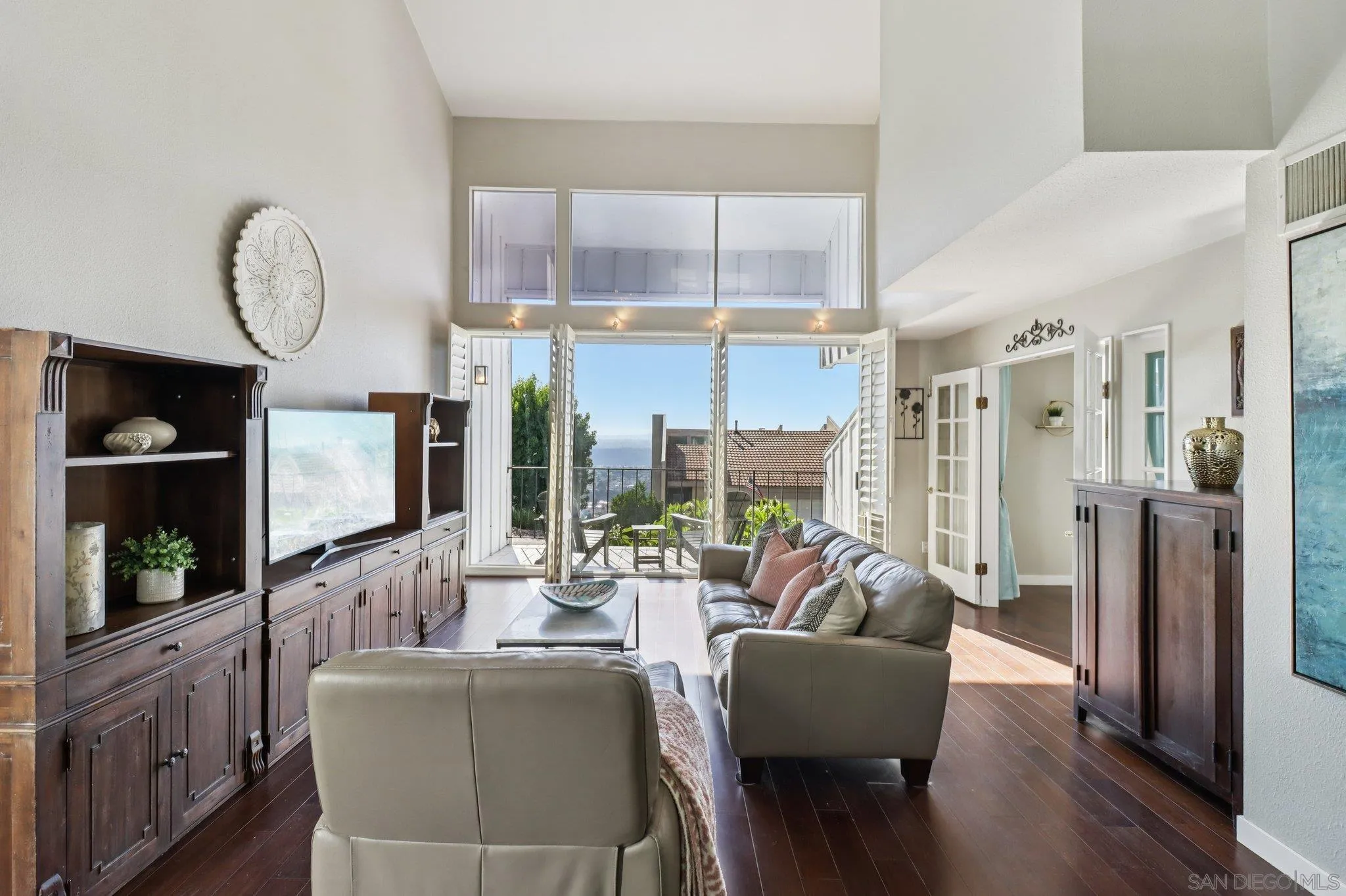 6329 Caminito Estrellado San Diego, CA 92120 - Photo 6 of 61 a living room with furniture a fireplace and a large window