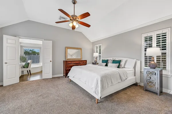 a bathroom with a sink double vanity and a bathtub