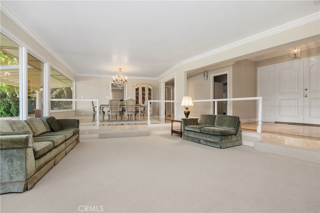 2086 Playa Road Carlsbad, CA 92009 - Photo 19 of 44 Living Room Featuring Floor to Ceiling Windows.