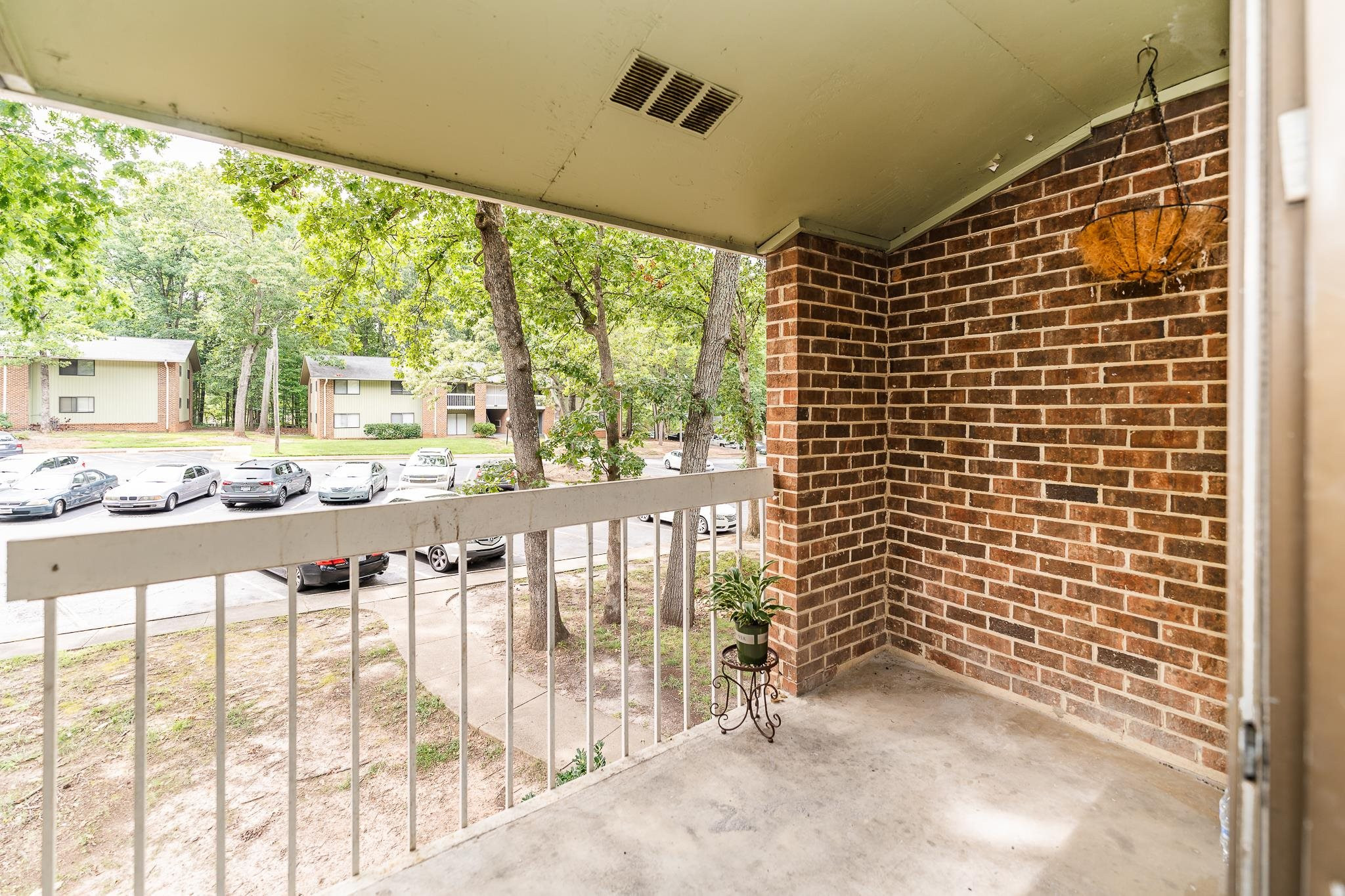 1281 Schaub Drive, Unit G Raleigh, NC 27606 - Photo 10 of 10 a balcony with table and chairs