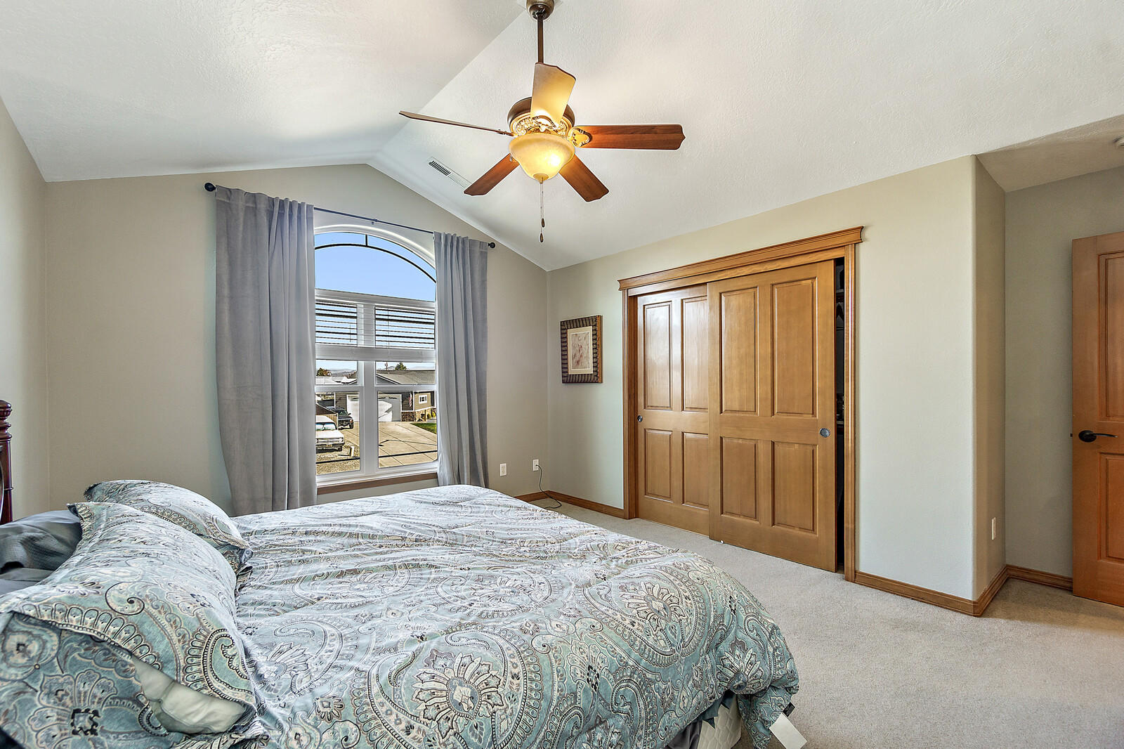 331 Ridgeway Avenue Central Point, OR 97502 - Photo 34 of 47 a bedroom with a bed and a chandelier