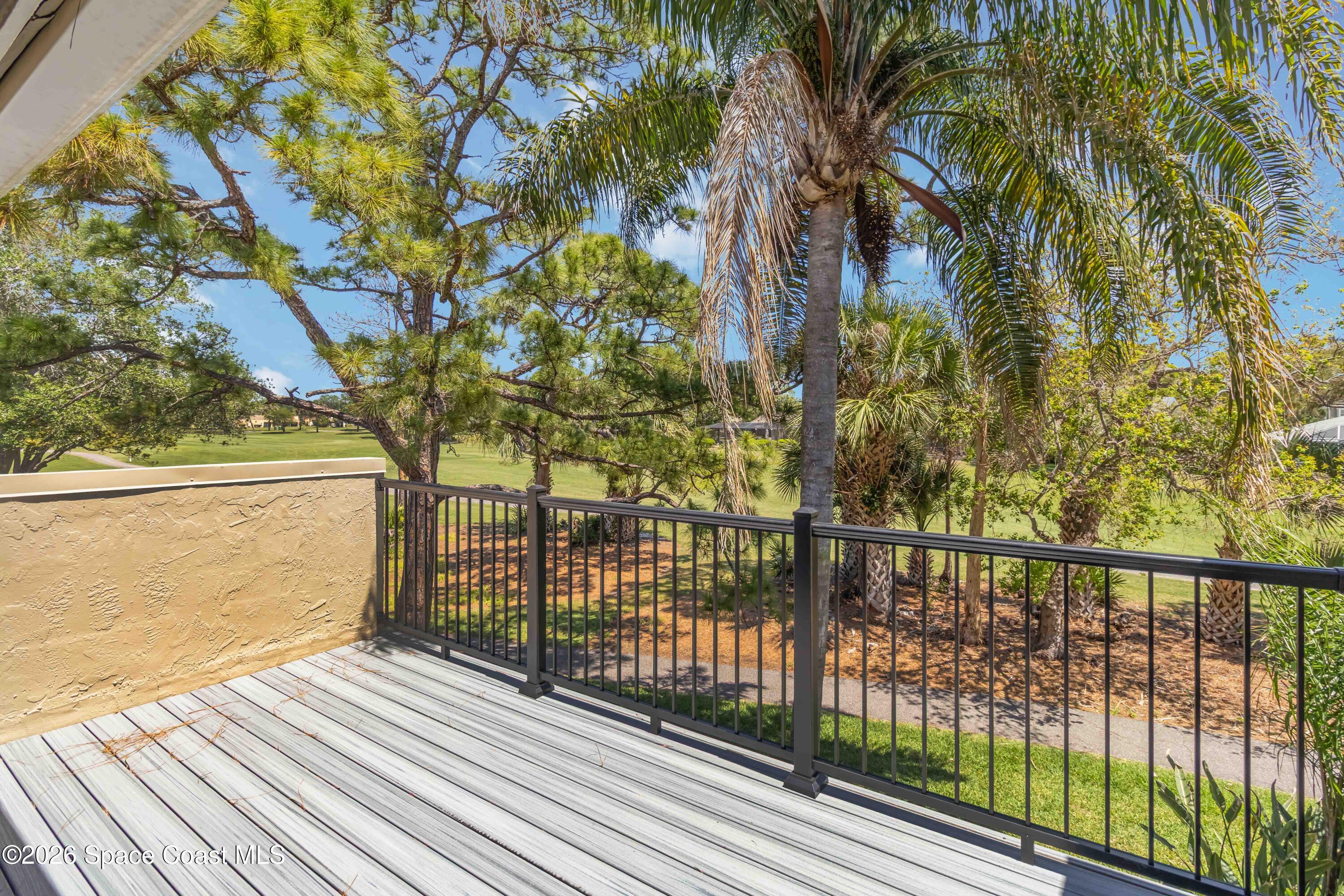 227 Augusta Way Melbourne, FL 32940 - Photo 22 of 38 a view of a balcony with wooden floor