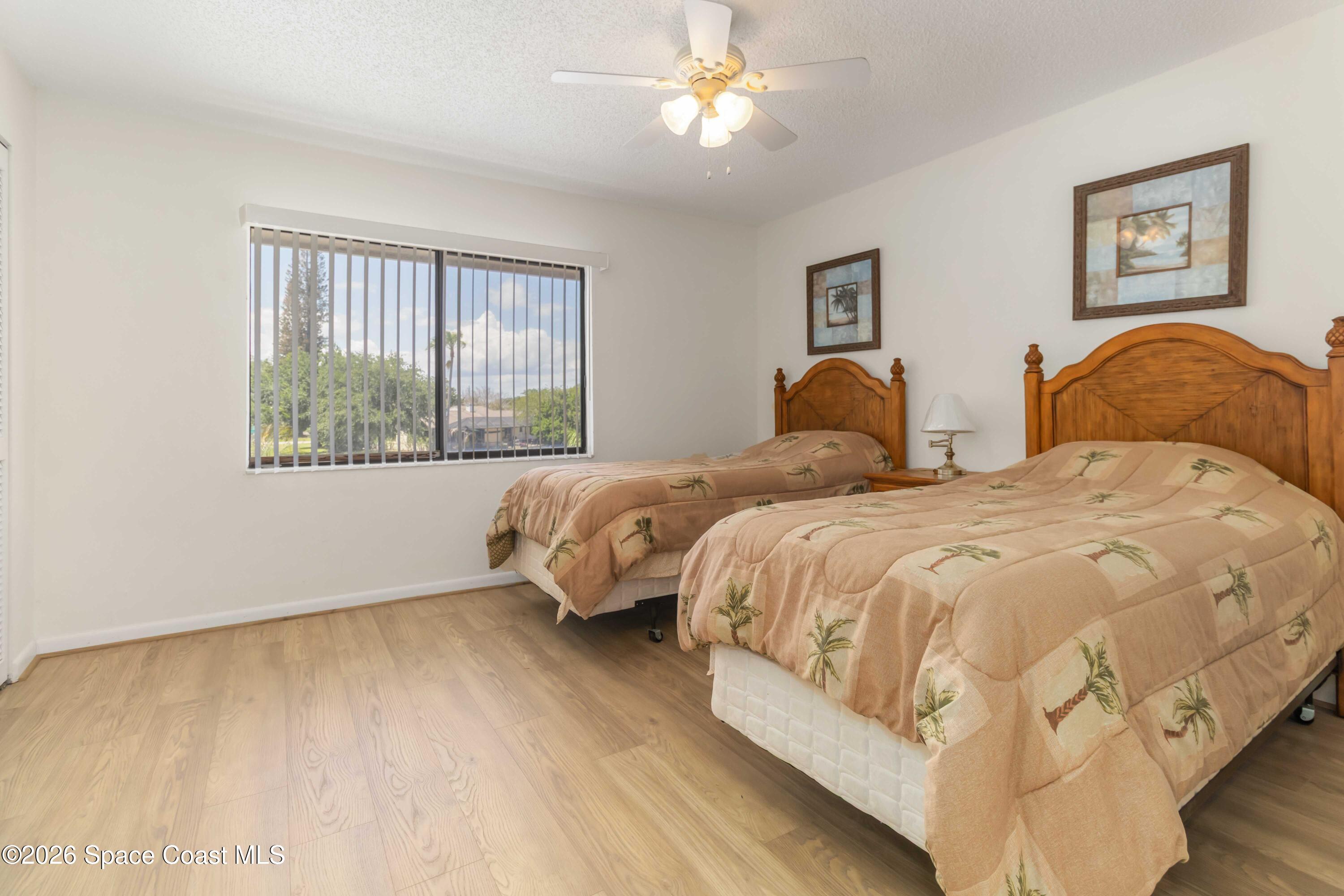 227 Augusta Way Melbourne, FL 32940 - Photo 26 of 38 a bedroom with a bed and a window