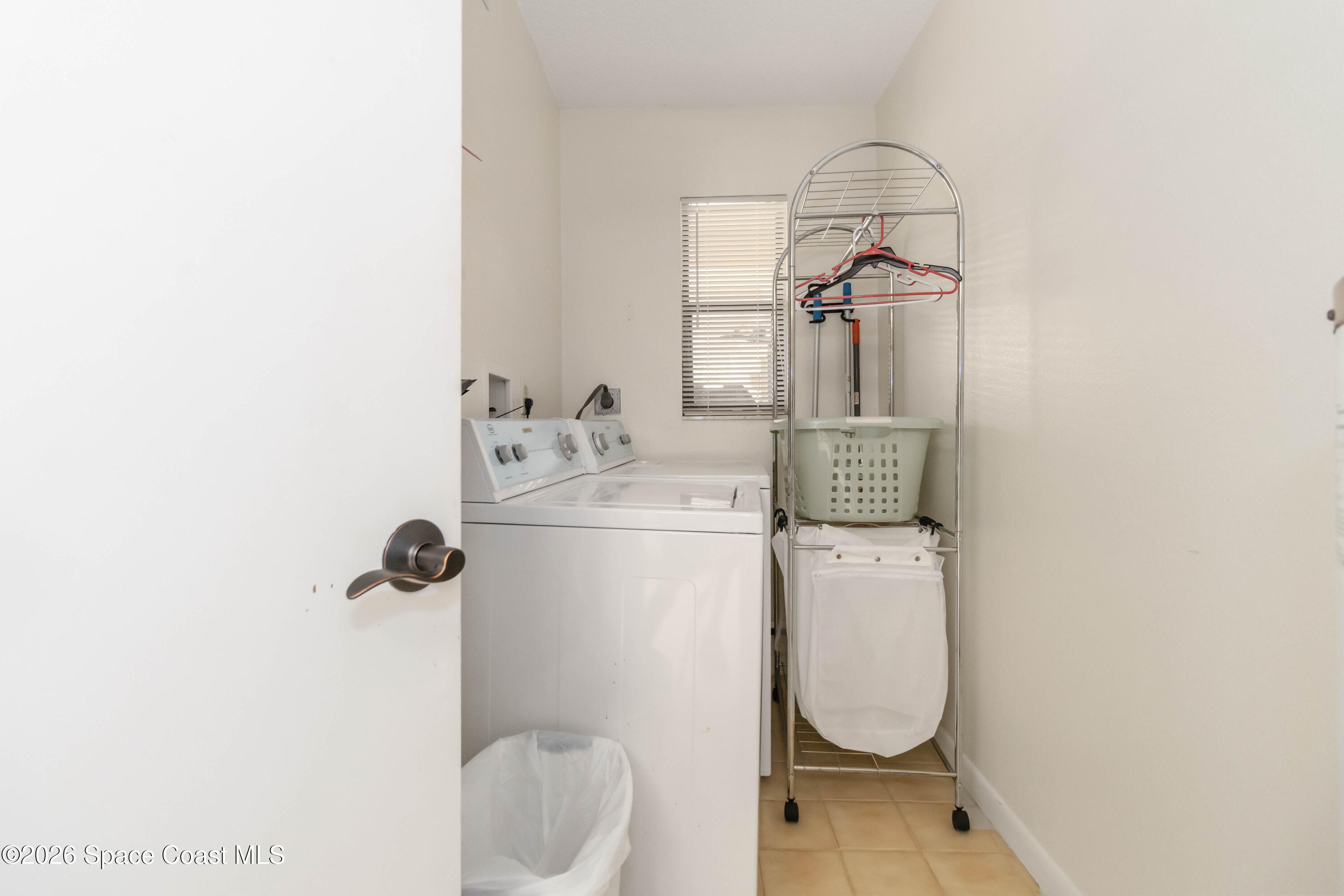 227 Augusta Way Melbourne, FL 32940 - Photo 29 of 38 a bathroom with a sink toilet and shower