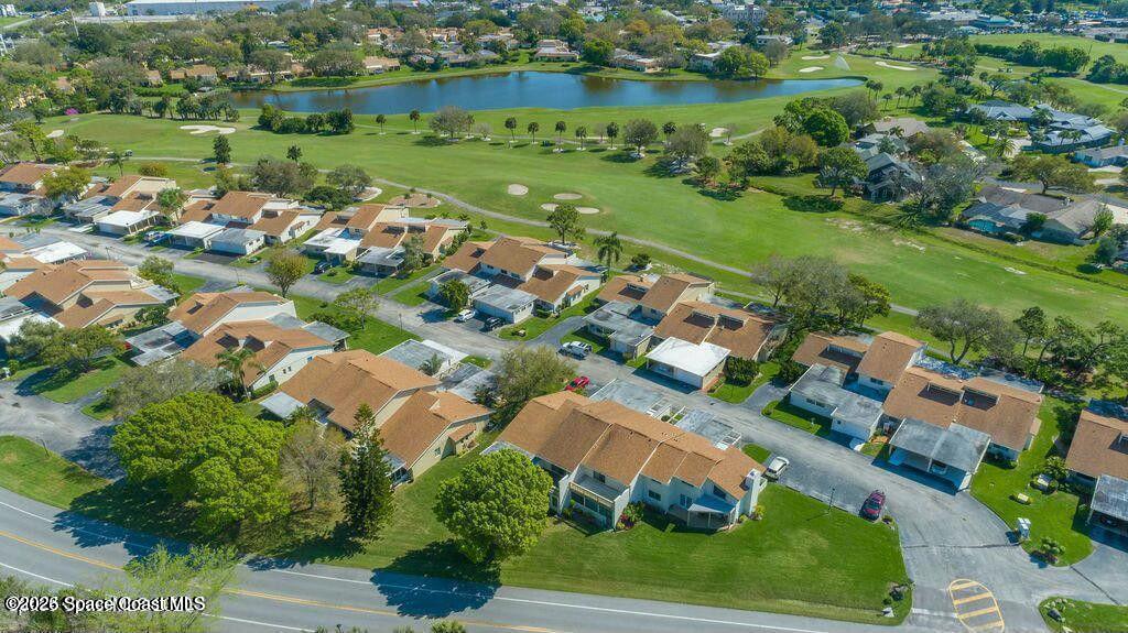 227 Augusta Way Melbourne, FL 32940 - Photo 3 of 38 an aerial view of a houses with outdoor space and street view
