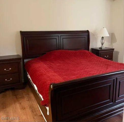 a bedroom with a bed and a dresser