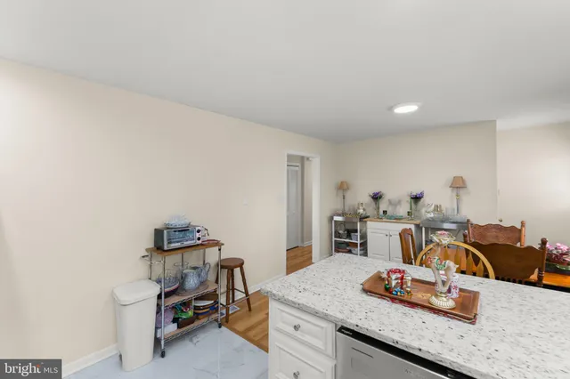 a kitchen with stainless steel appliances a refrigerator sink and microwave