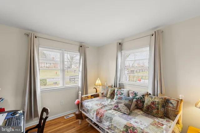 a bed room with a bed and a window