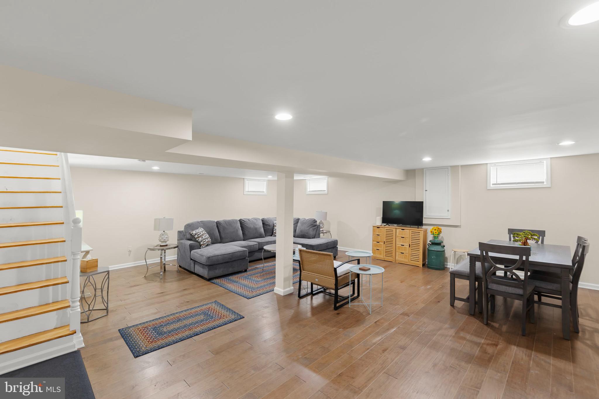 250 Co Rte 340/7 Charles Town, WV 25414 - Photo 26 of 42 a living room with furniture and a flat screen tv with kitchen view