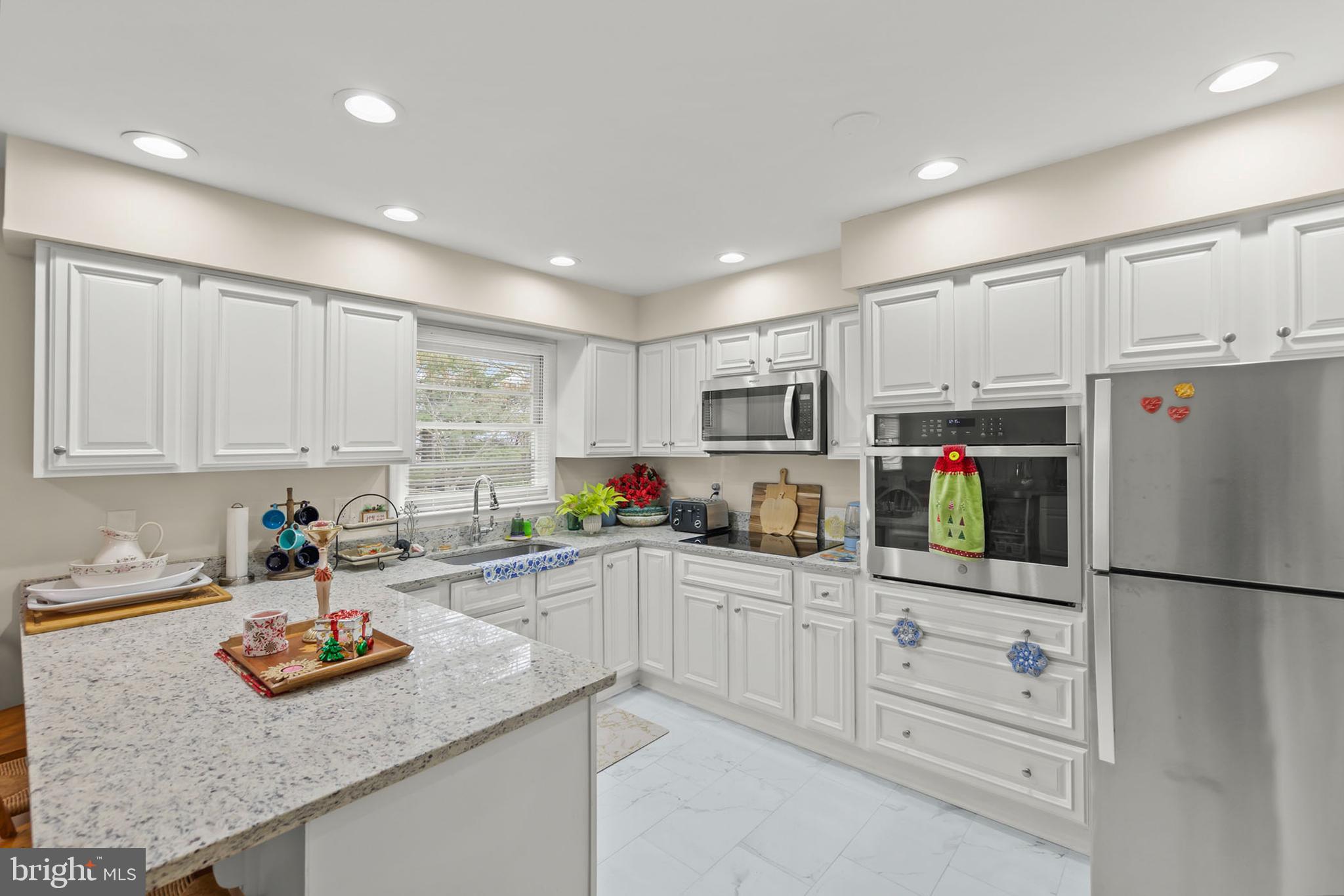 250 Co Rte 340/7 Charles Town, WV 25414 - Photo 8 of 42 a kitchen with white cabinets and white appliances