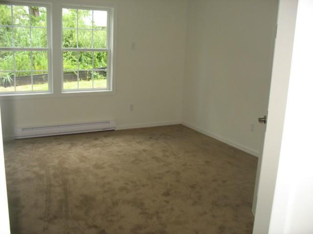 41 Grand Street, Unit 102 Danbury, CT 06810 - Photo 8 of 13 an empty room with a window