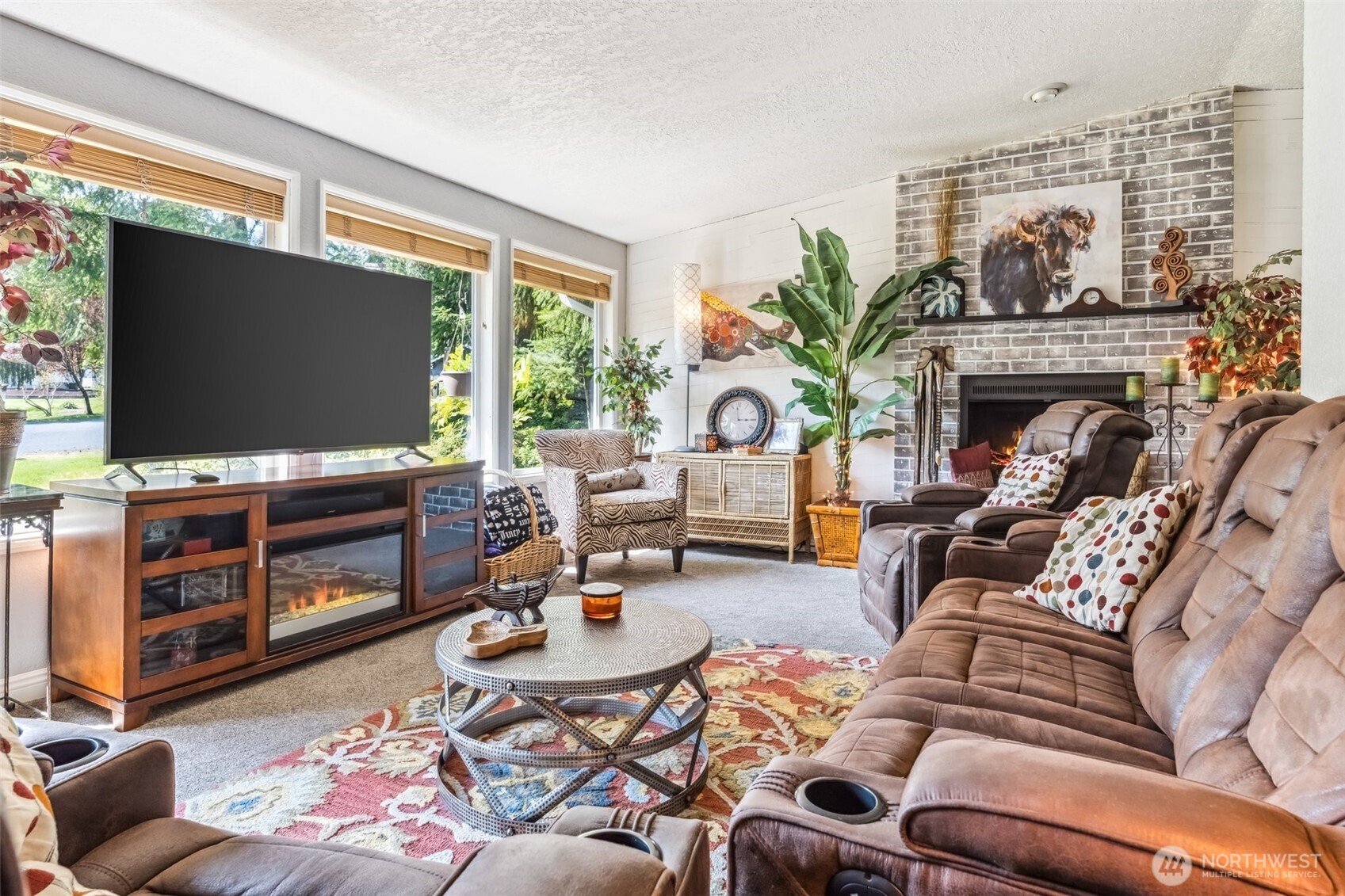 122 Fir Drive Chehalis, WA 98532 - Photo 3 of 34 a living room with furniture a flat screen tv and a fireplace