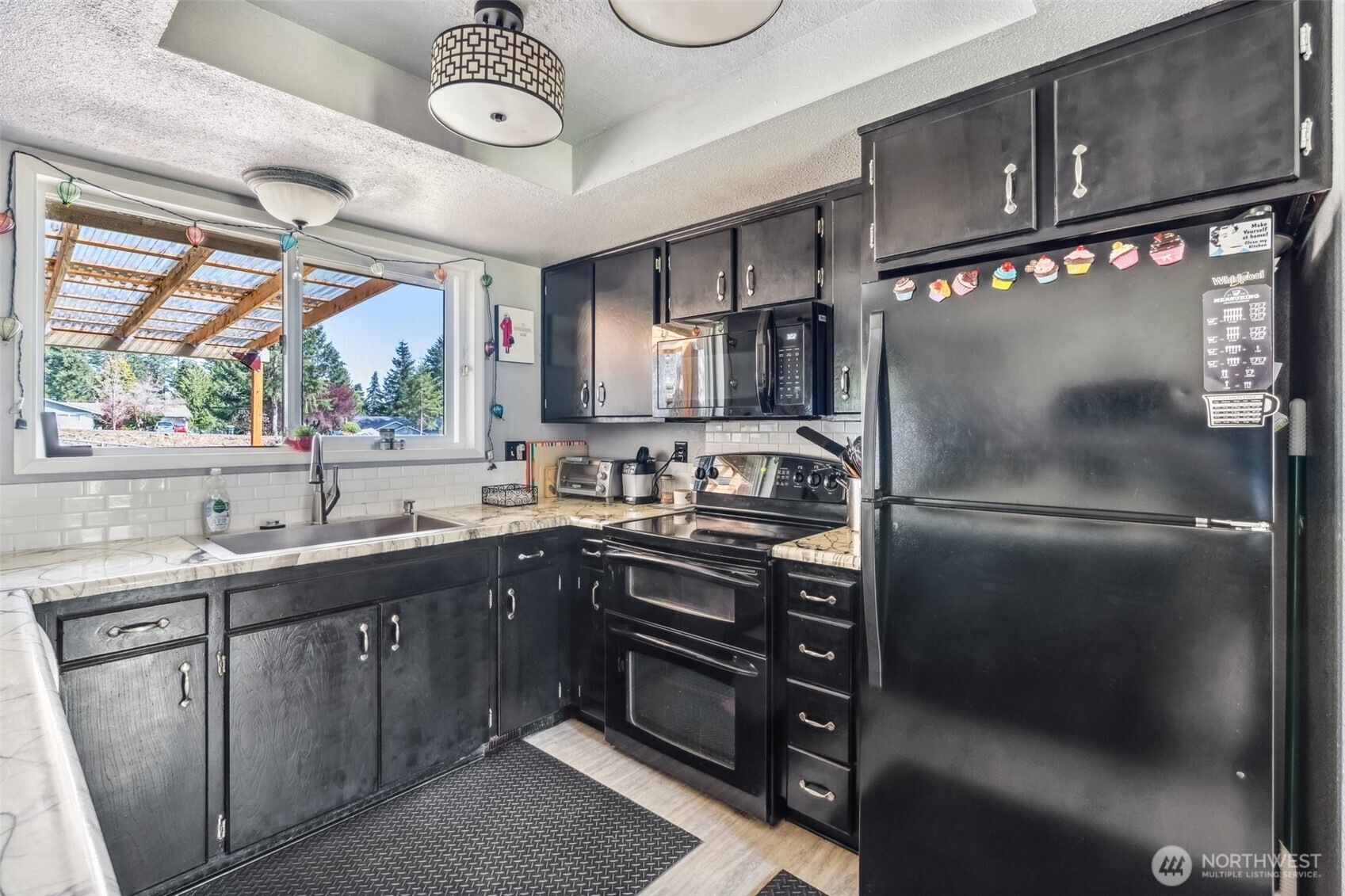 122 Fir Drive Chehalis, WA 98532 - Photo 9 of 34 a kitchen with stainless steel appliances granite countertop a sink a stove and a refrigerator