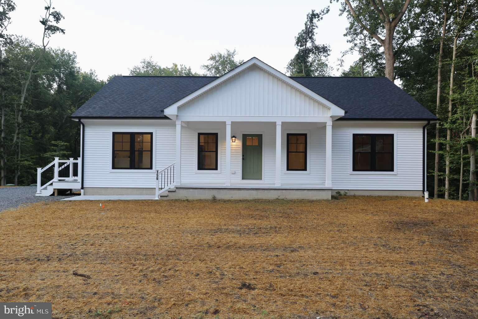 a house that has a large pool in front of it
