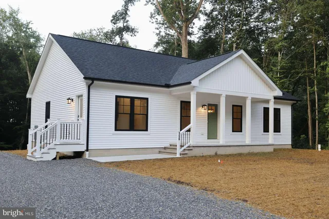 a front view of a house with yard