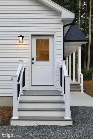 a front view of a house with a porch