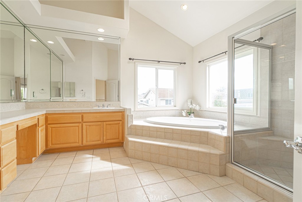 2216 Clark Lane, Unit A Redondo Beach, CA 90278 - Photo 12 of 20 a spacious bathroom with a granite countertop sink a mirror and a bathtub