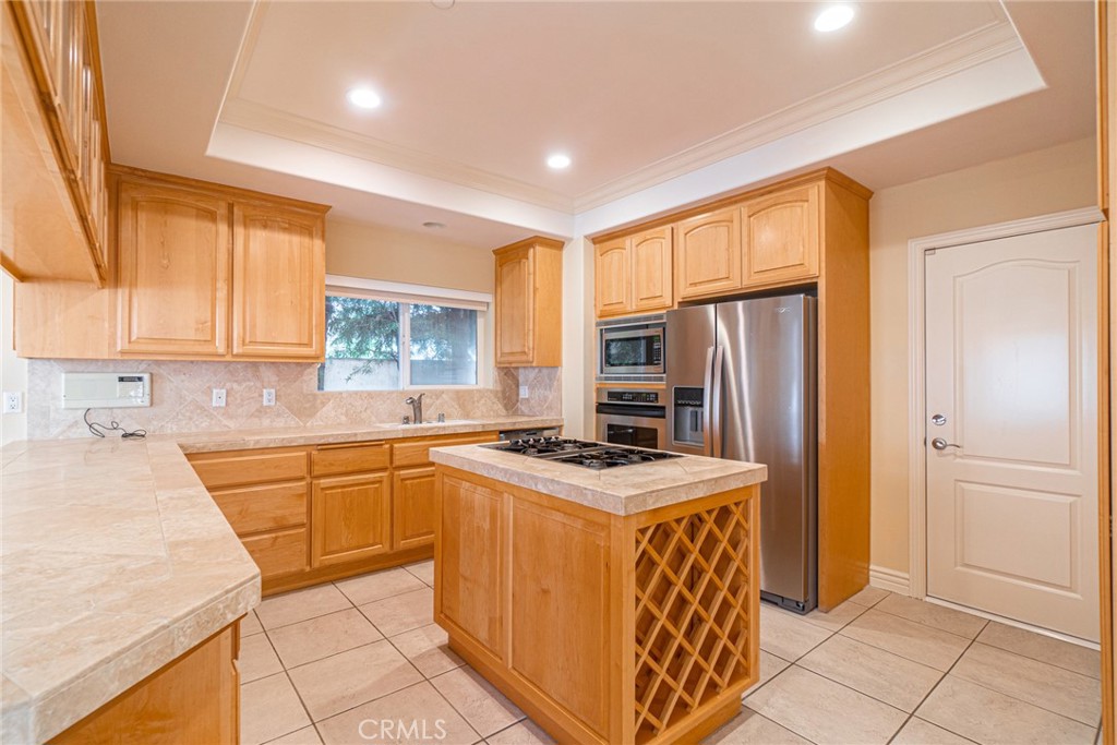 2216 Clark Lane, Unit A Redondo Beach, CA 90278 - Photo 6 of 20 a kitchen with stainless steel appliances granite countertop a sink stove and refrigerator