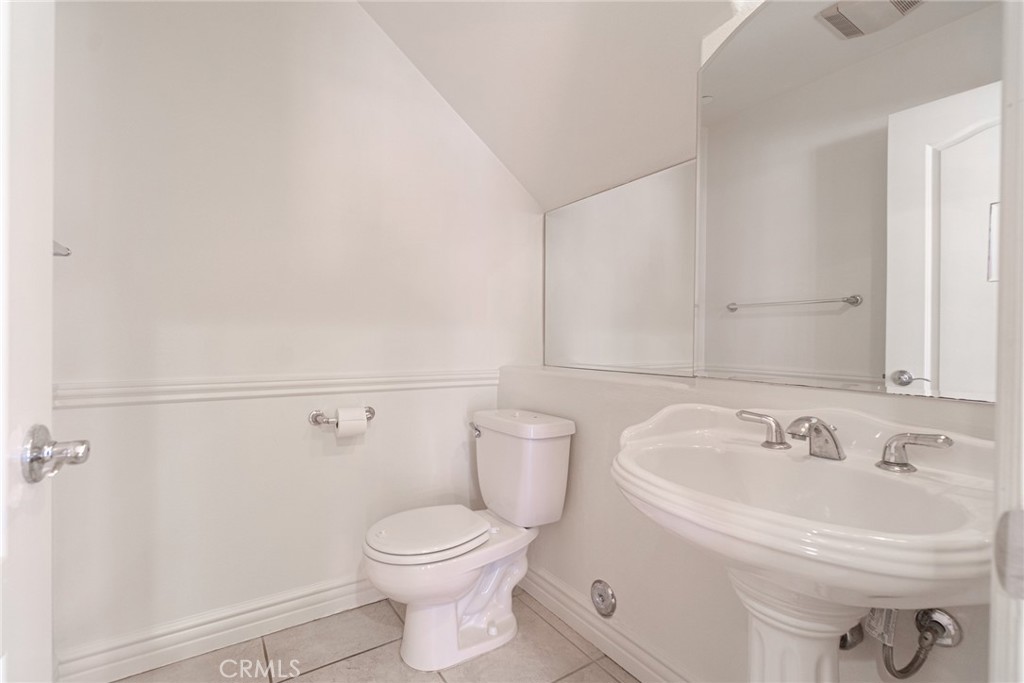 2216 Clark Lane, Unit A Redondo Beach, CA 90278 - Photo 8 of 20 a white toilet sitting next to a bathroom sink