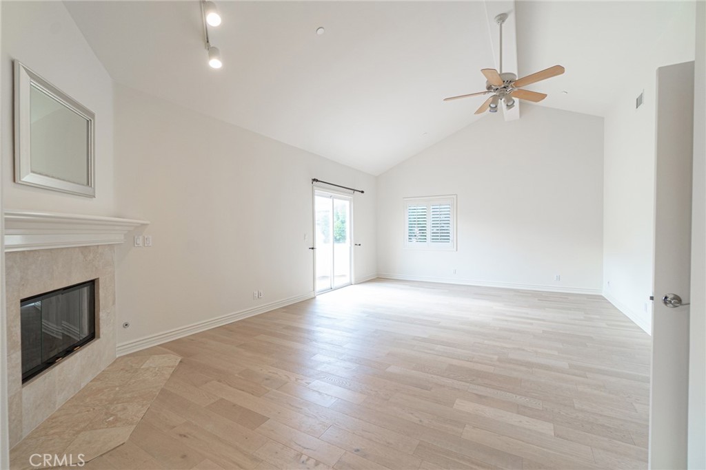 2216 Clark Lane, Unit A Redondo Beach, CA 90278 - Photo 10 of 20 a view of an empty room with a fireplace and a window