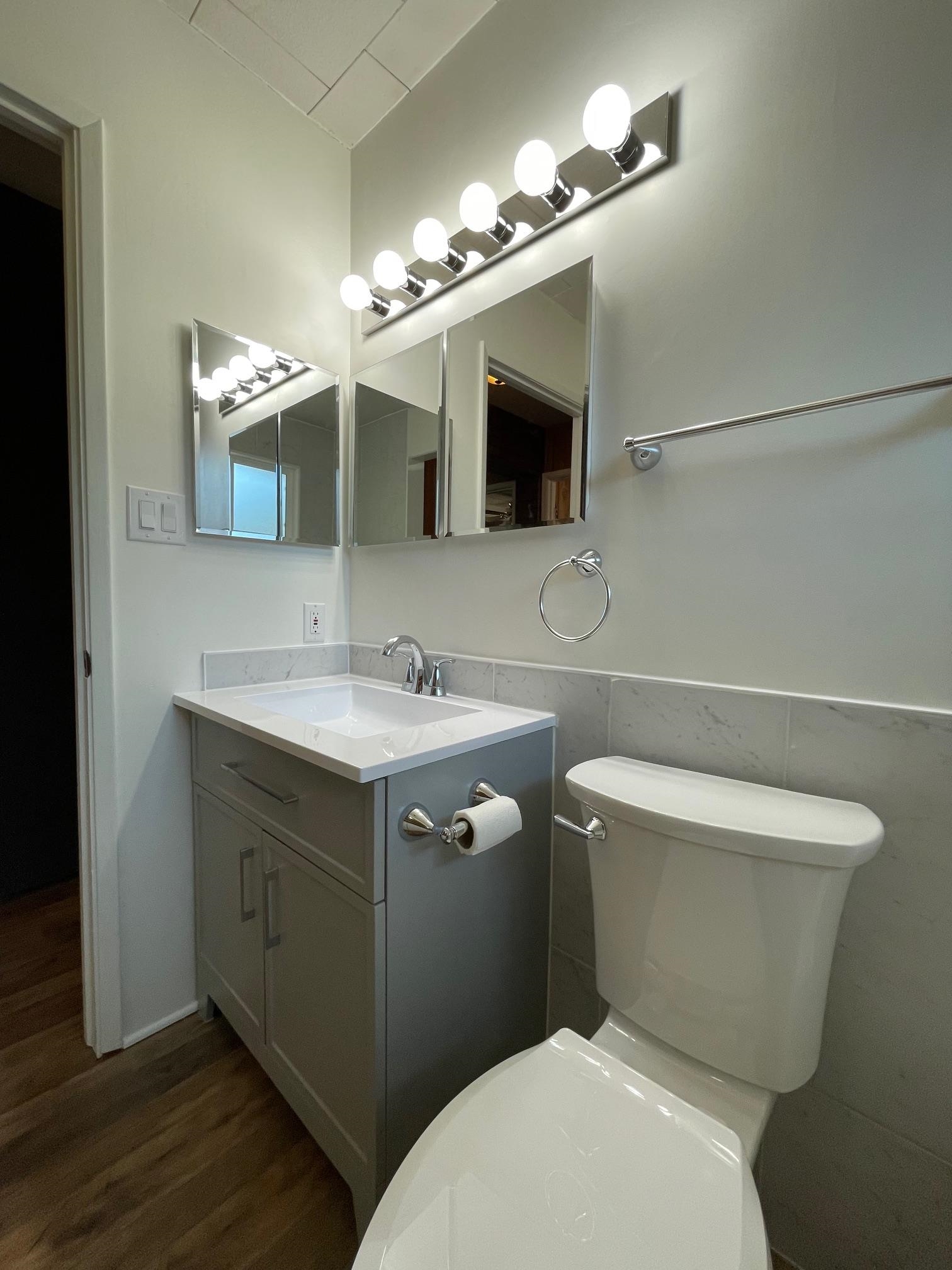 18191 Woodham Carne Road Sonora, CA 95370 - Photo 11 of 47 a bathroom with a toilet sink and mirror