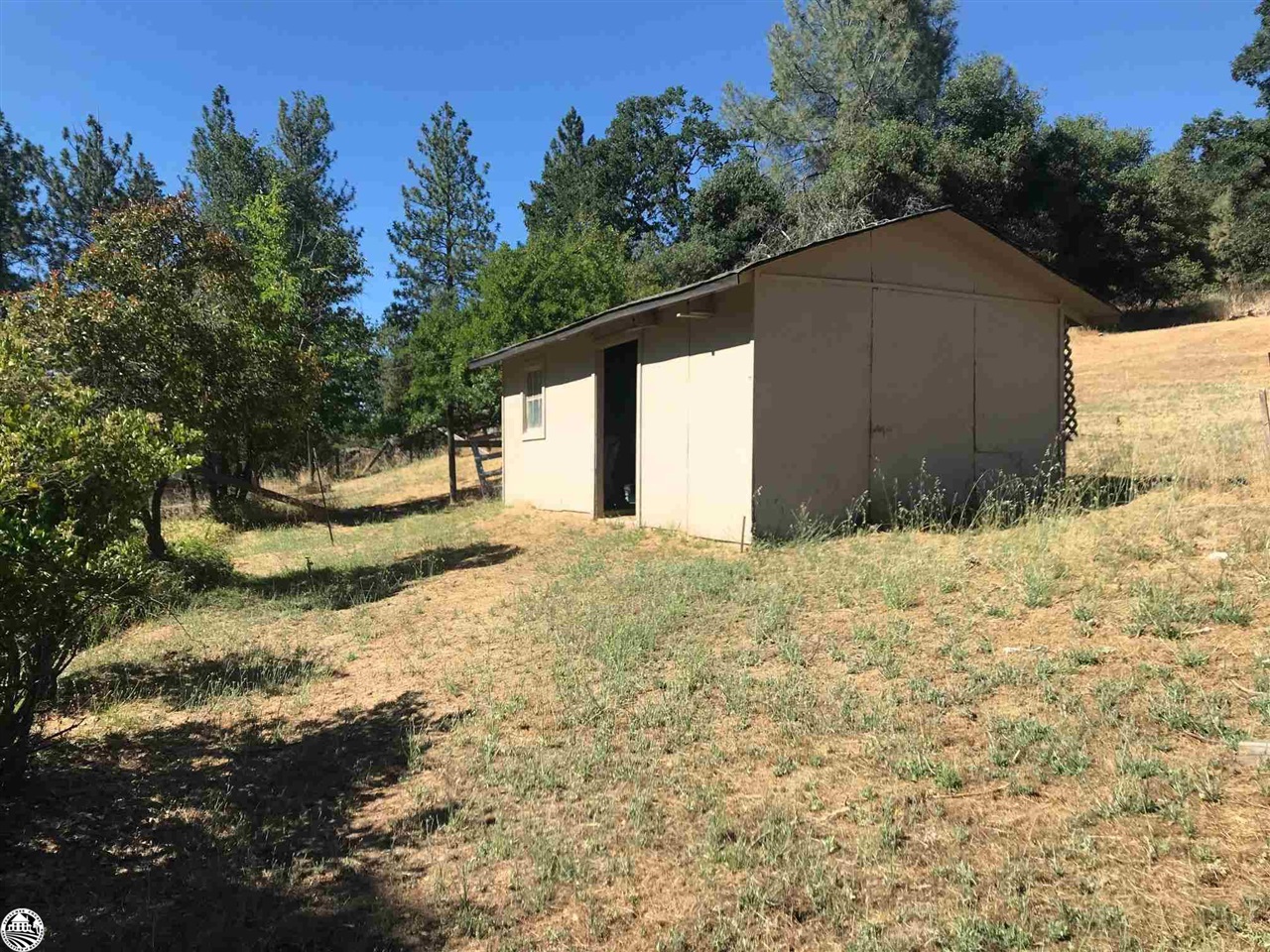 18191 Woodham Carne Road Sonora, CA 95370 - Photo 35 of 47 a house with trees in the background