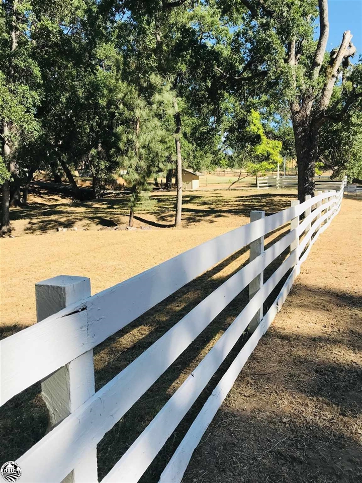 18191 Woodham Carne Road Sonora, CA 95370 - Photo 6 of 47 a view of a swimming pool with an outdoor space