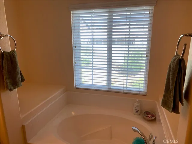 a bath tub sitting next to a window