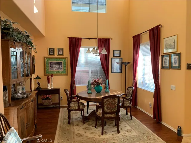 a view of a dining room with furniture and window