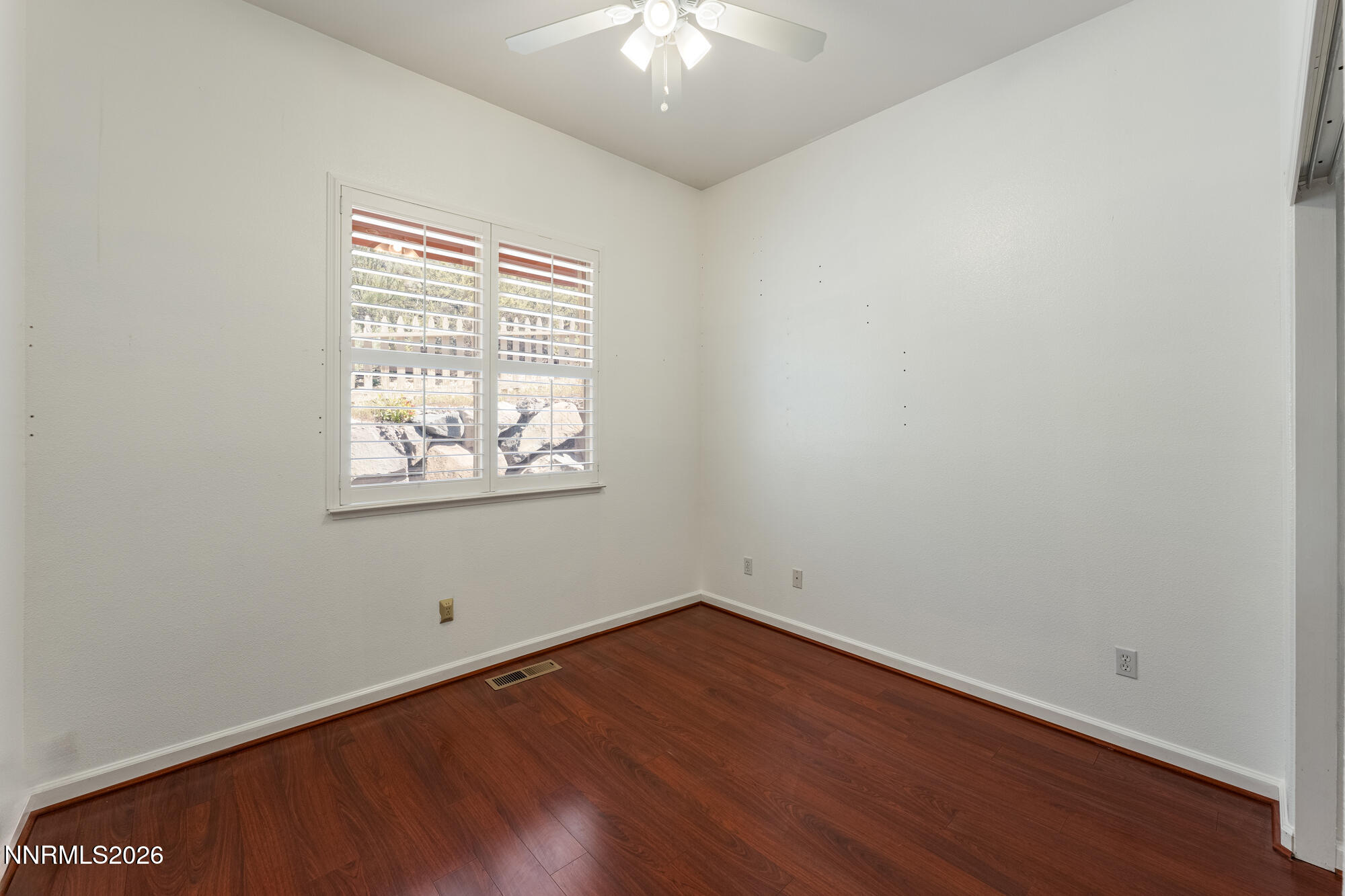 1840 Hunter Creek Road Reno, NV 89519 - Photo 26 of 39 an empty room with wooden floor and windows