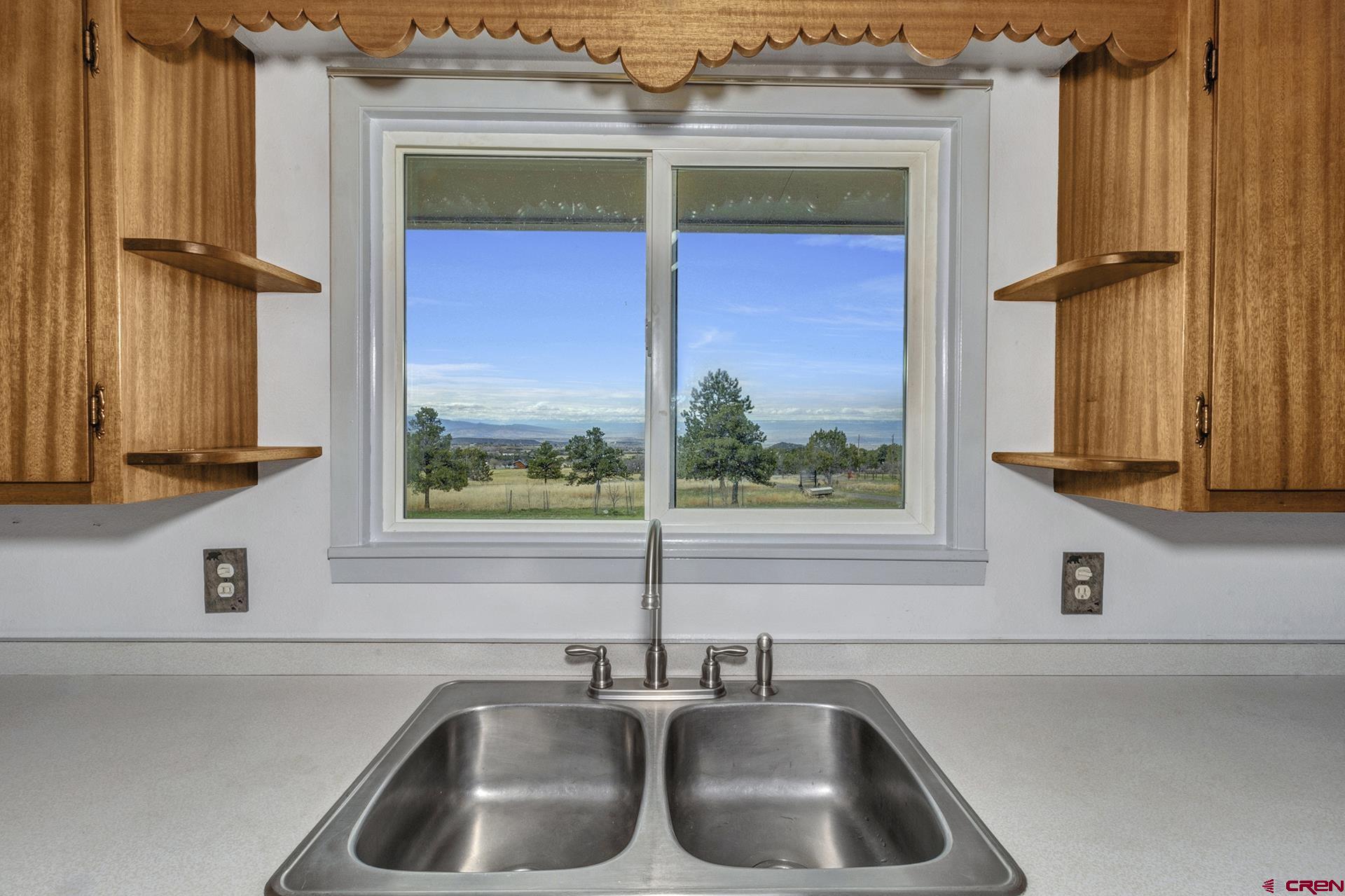 22755 Uintah Road Cedaredge, CO 81413 - Photo 11 of 35 a kitchen sink with a window