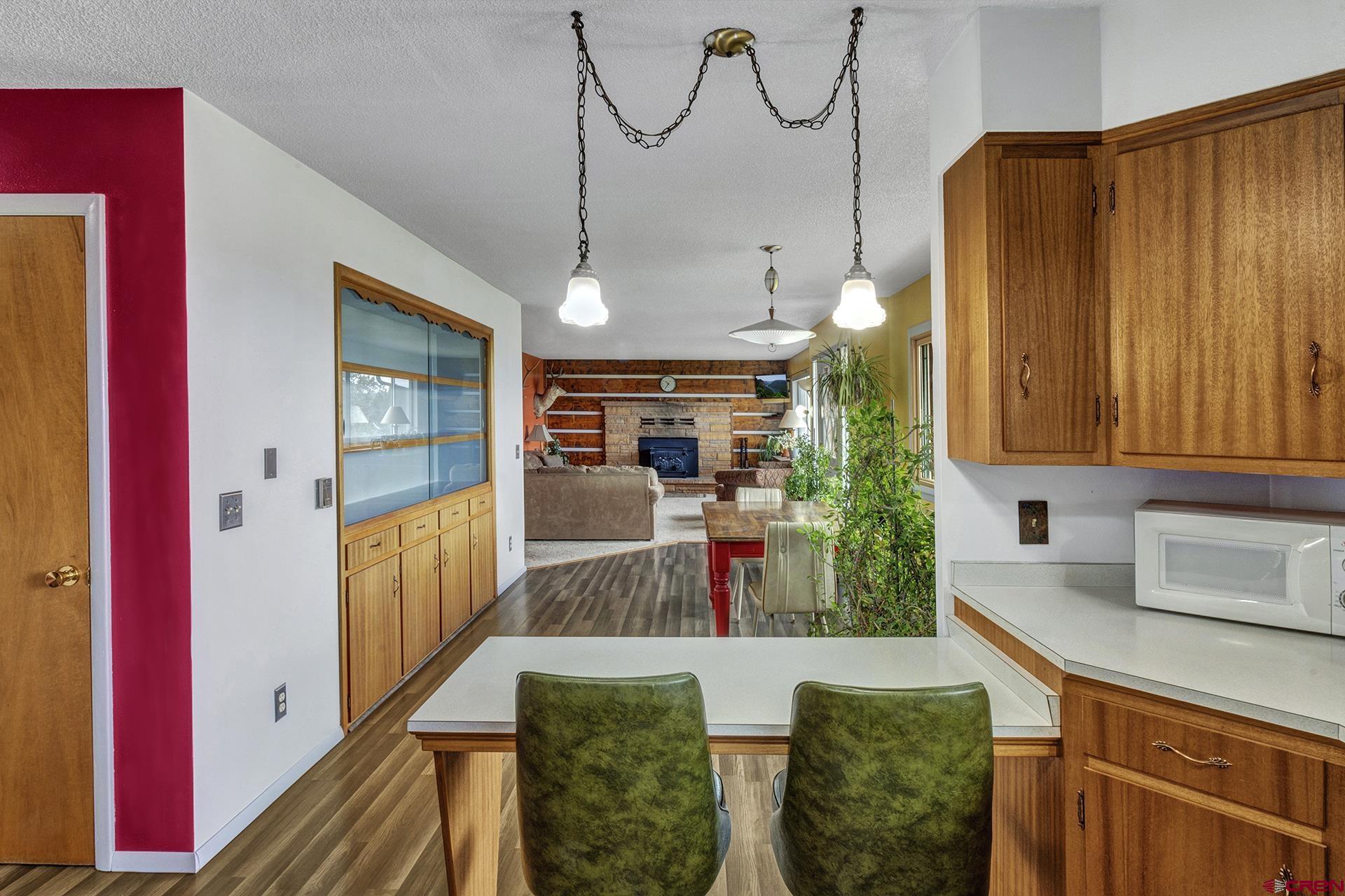 22755 Uintah Road Cedaredge, CO 81413 - Photo 13 of 35 a view of a kitchen and dining room