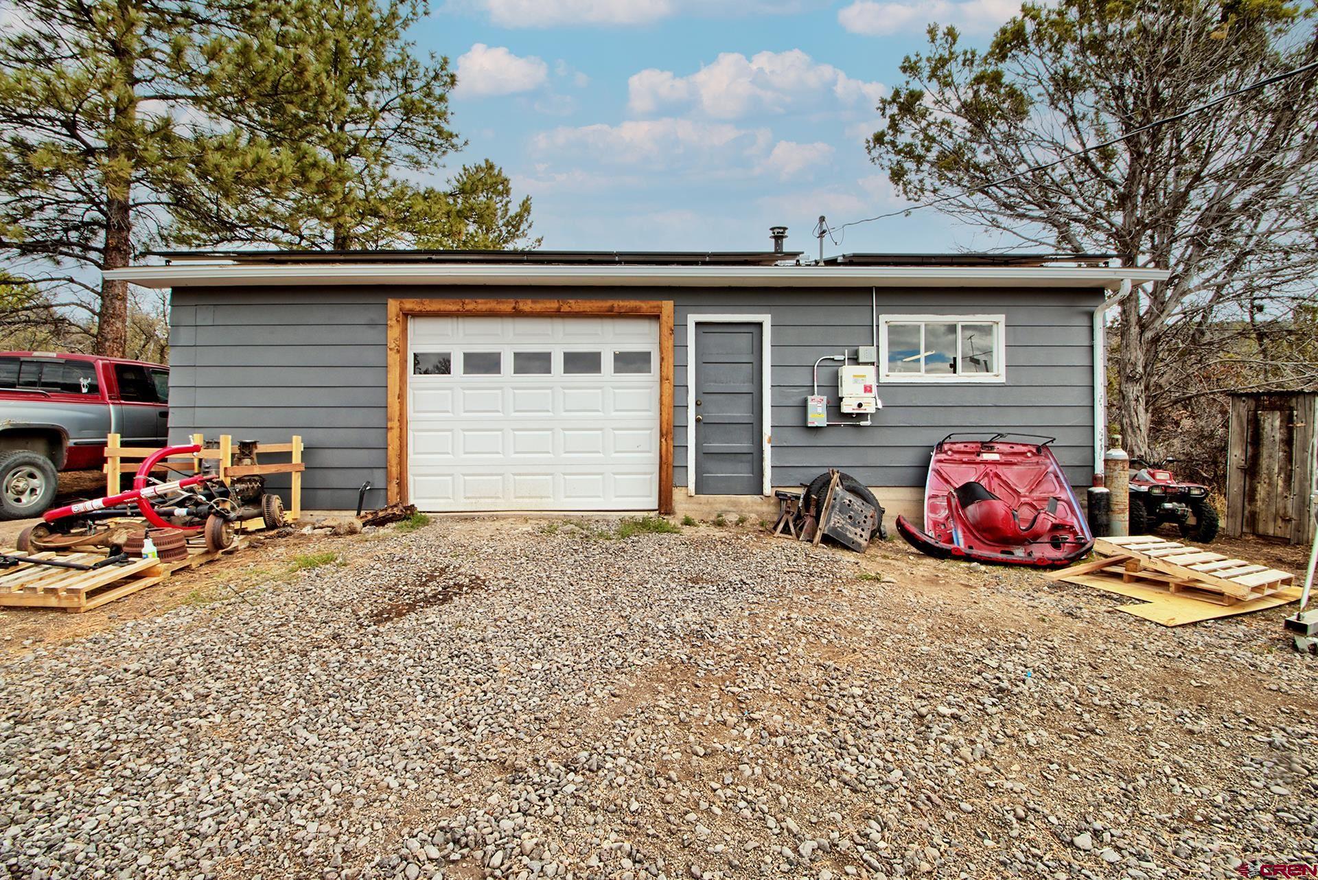 22755 Uintah Road Cedaredge, CO 81413 - Photo 28 of 35 a front view of a house with garage
