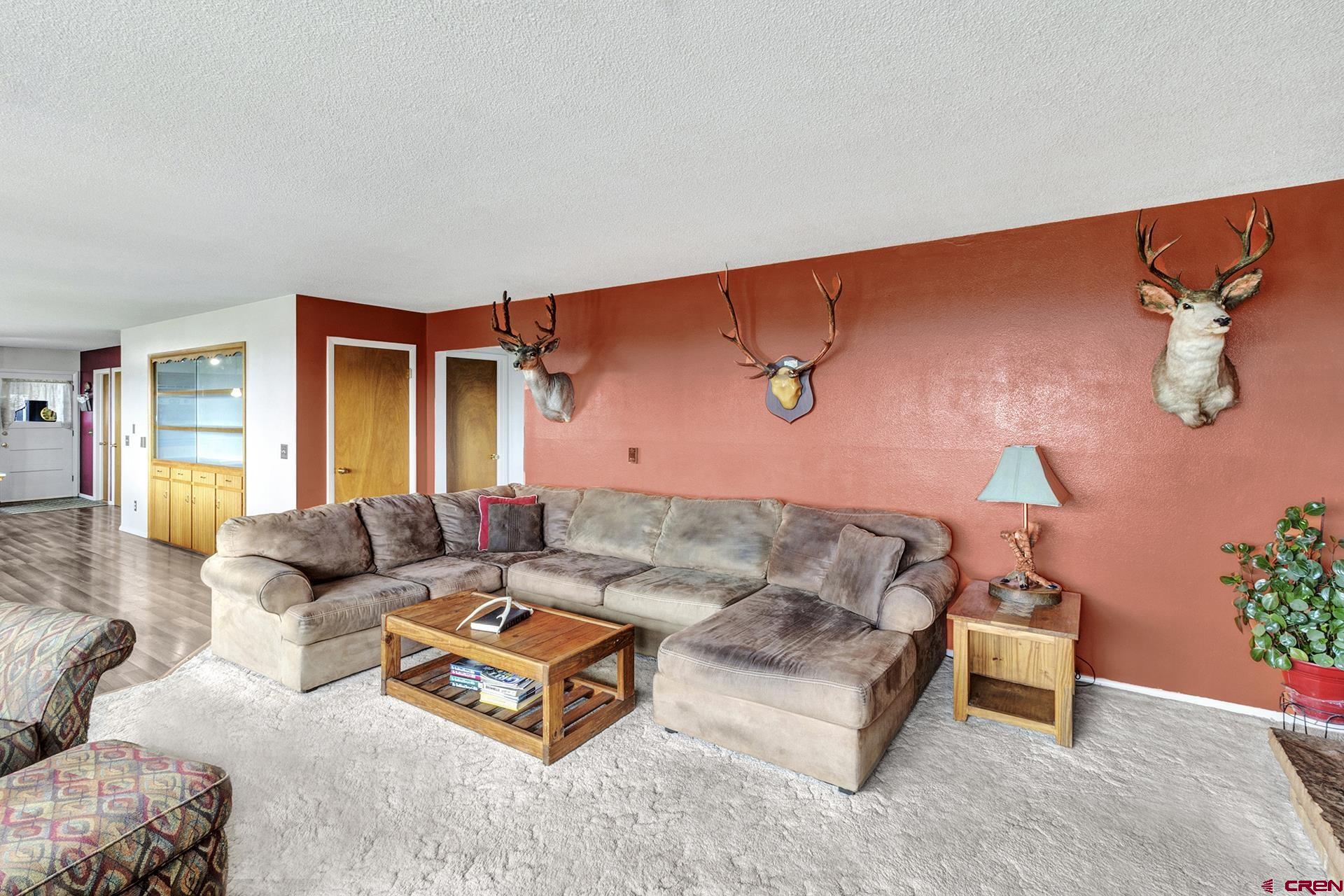 22755 Uintah Road Cedaredge, CO 81413 - Photo 6 of 35 a living room with furniture and a couch