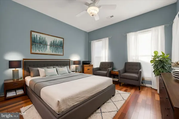 a spacious bedroom with a bed and a couch