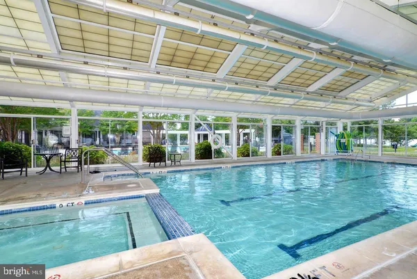 a view of a swimming pool with a patio