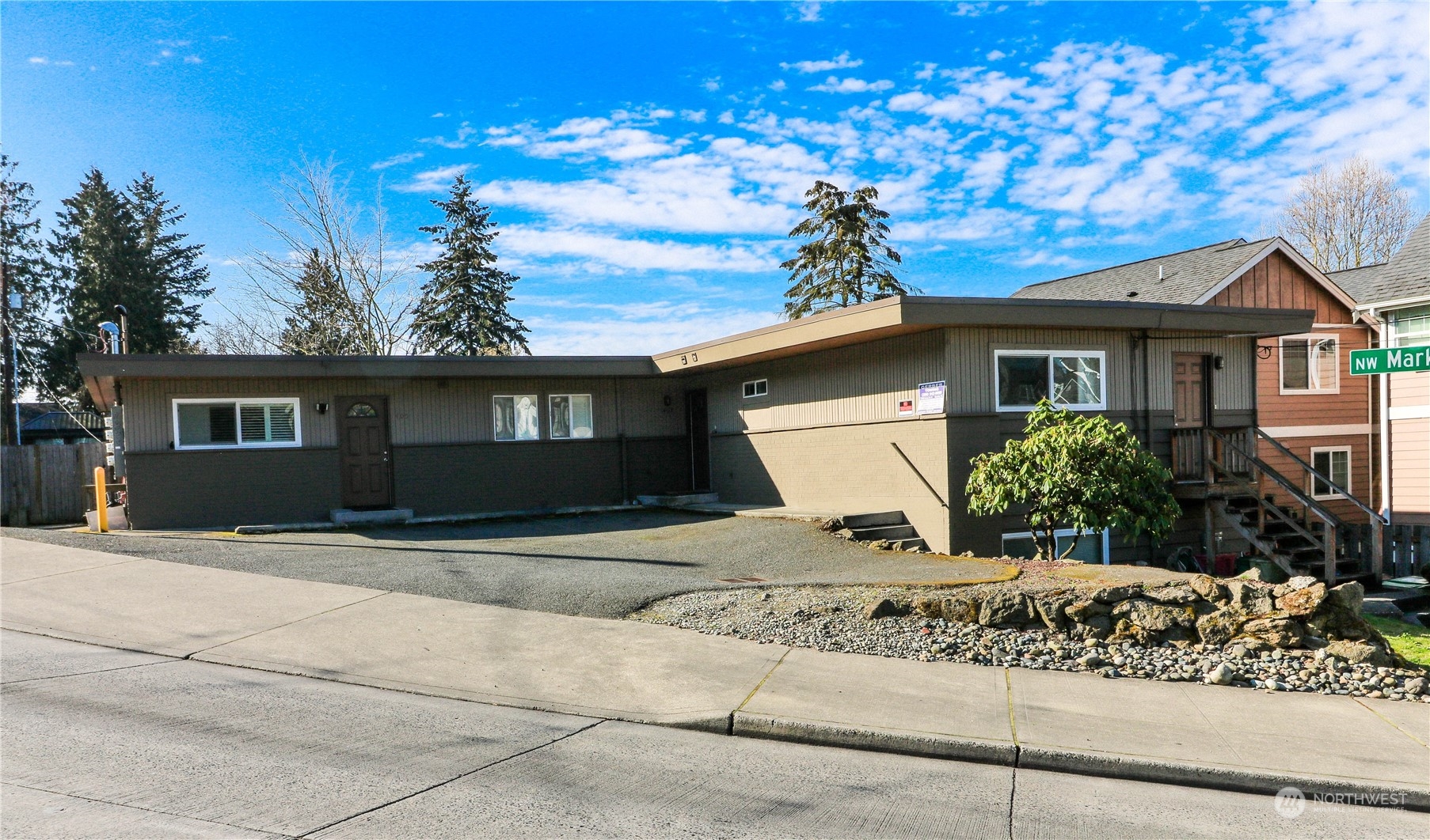 a front view of a house with garden