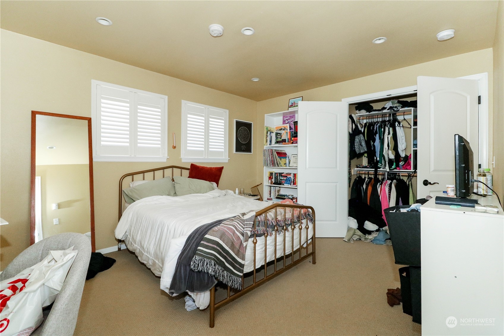 405 Northwest Market Street Seattle, WA 98107 - Photo 13 of 33 a bedroom with a bed closet and a window