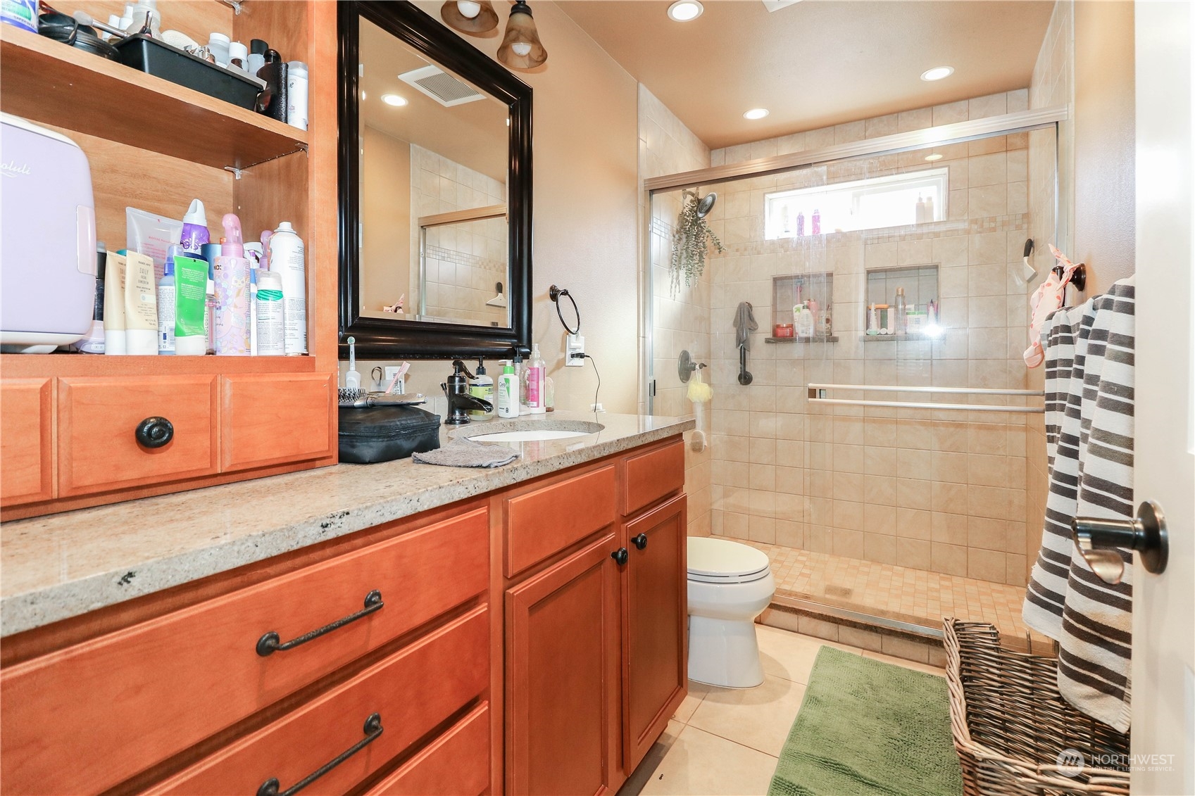 405 Northwest Market Street Seattle, WA 98107 - Photo 14 of 33 a bathroom with a double vanity sink toilet mirror and shower