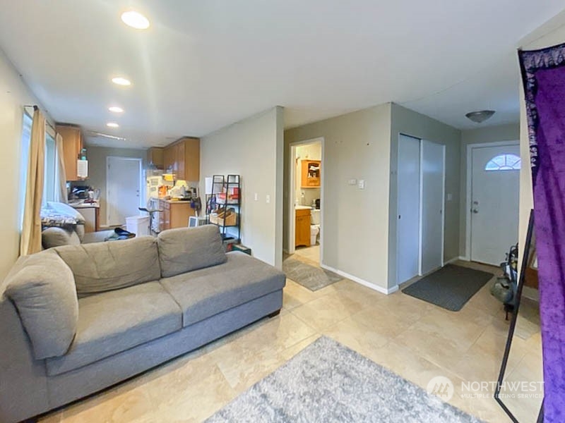 405 Northwest Market Street Seattle, WA 98107 - Photo 18 of 33 a living room with furniture and a gym machine