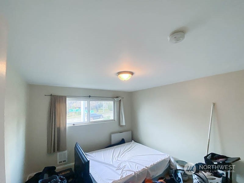 405 Northwest Market Street Seattle, WA 98107 - Photo 22 of 33 a bedroom with a bed and a window