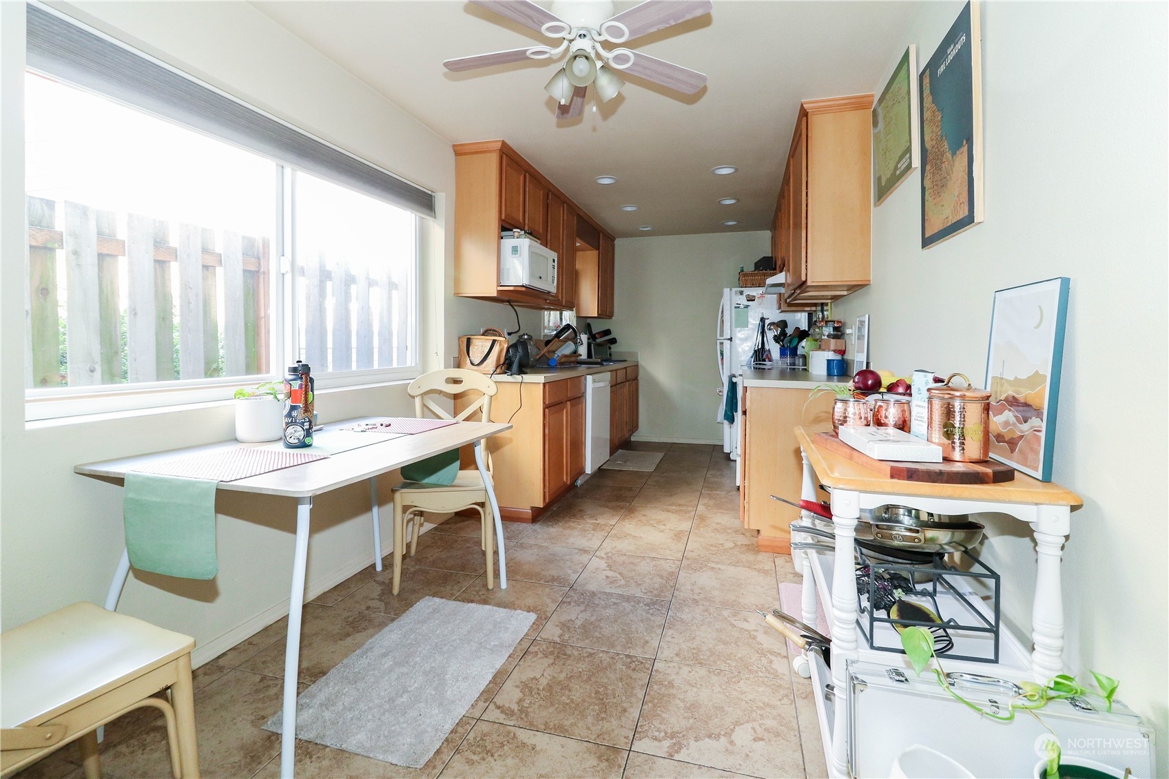 405 Northwest Market Street Seattle, WA 98107 - Photo 26 of 33 a work place with kitchen island granite countertop furniture a rug and stainless steel appliances