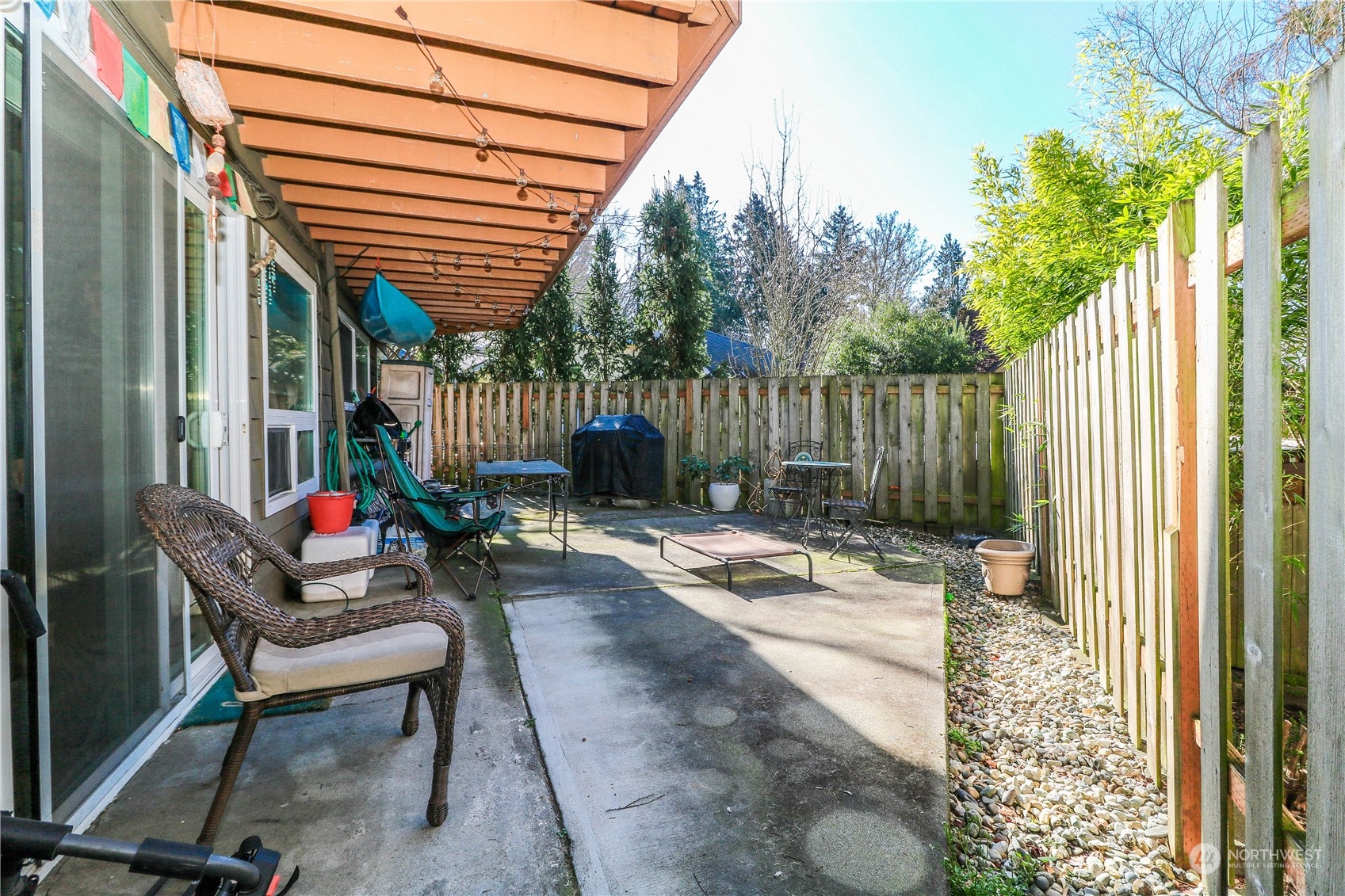 405 Northwest Market Street Seattle, WA 98107 - Photo 32 of 33 a backyard of a house with fountain and outdoor seating