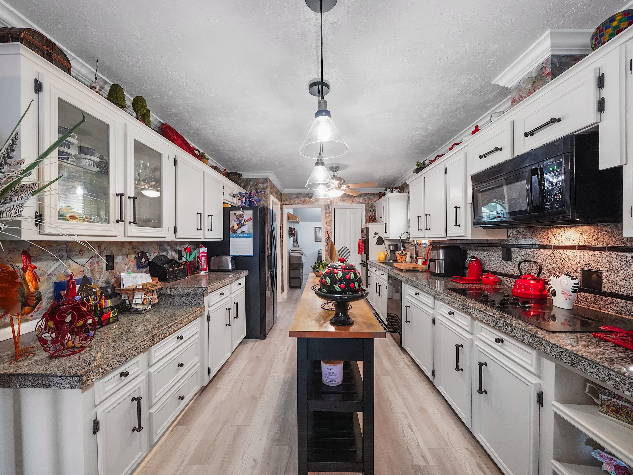 14014 Locke Lane Houston, TX 77077 - Photo 11 of 35 a kitchen with stainless steel appliances kitchen island granite countertop lots of counter top space